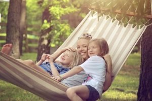 Family sitting in hammock