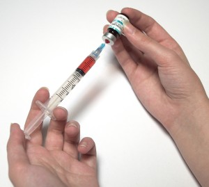 Filling syringe with vaccine